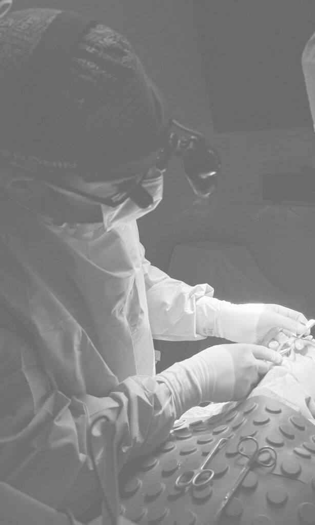 Dr Vranis in OR with a patient
